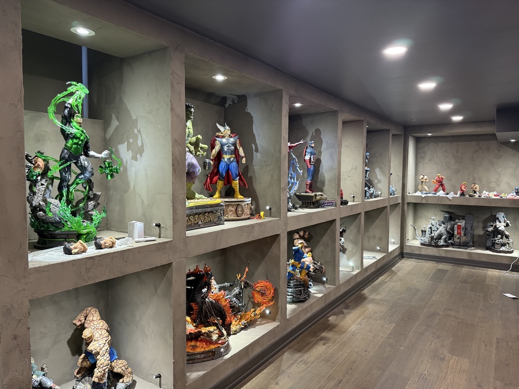 Lit display shelving in a basement collection room