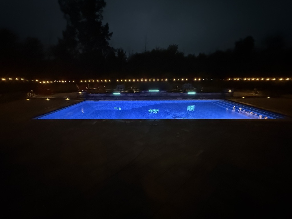 Pool lighting and string lights at night